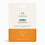 The Body Shop Vitamin C Glow Sheet Mask packaging, featuring a cream and orange color-blocked design with green and orange text.