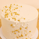 Ninos Golden Celebrations Cake & 20 Red Roses