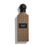 Perfume bottle with geometric design and 'Grey Pearl Diamond' label on a white background