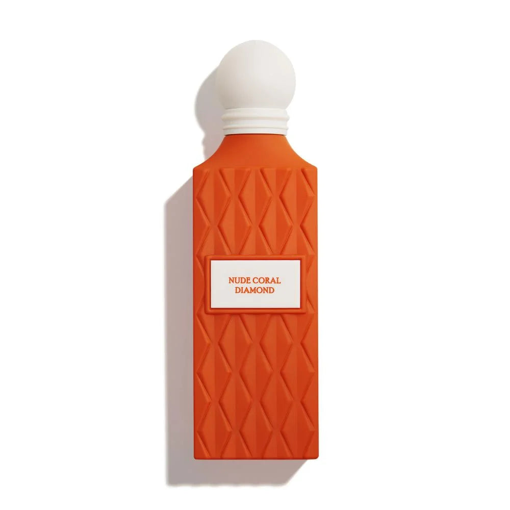 Orange perfume bottle with white cap on a white background