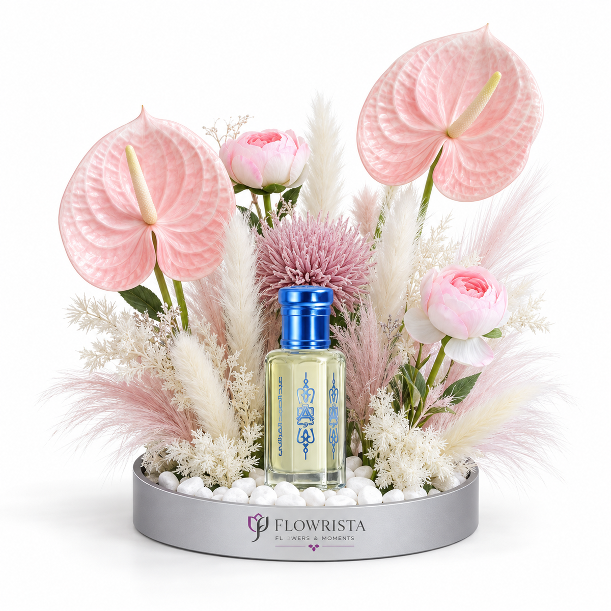 Al Khitam Musk perfume oil by Abdul Samad al Qurashi with pink anthurium, ranunculus, allium and pampas grass in Flowrista silver mirrored tray — luxury floral gift set Dubai