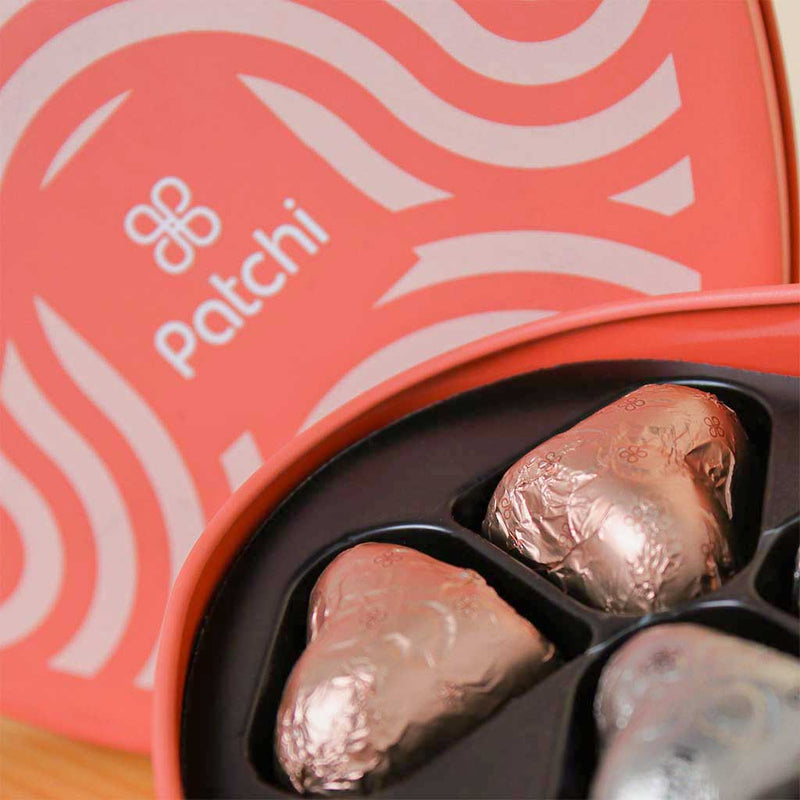 Patchi Tin Box of 22 Pieces and 20 red roses