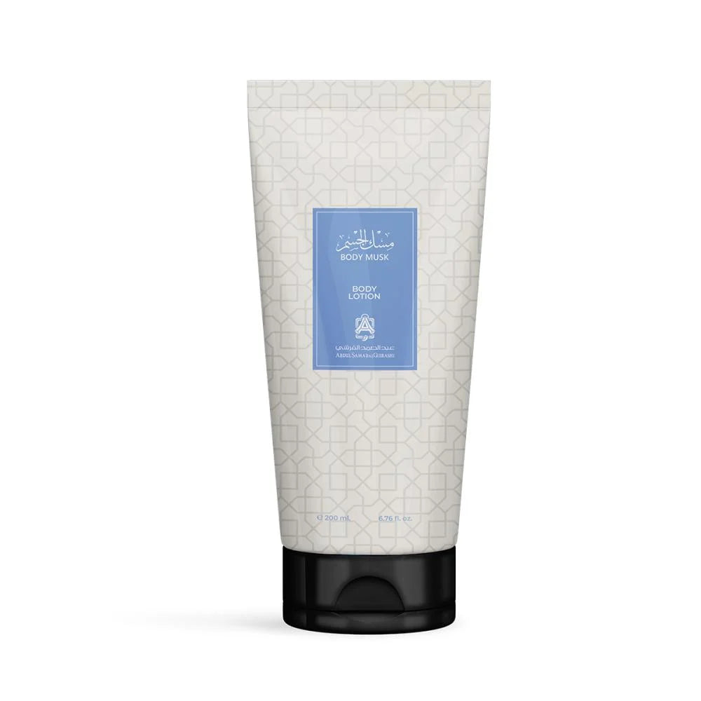 A tube of Al Mahmoud Body Lotion with a black cap, featuring a cream-colored body with a light geometric pattern and a central light blue label.