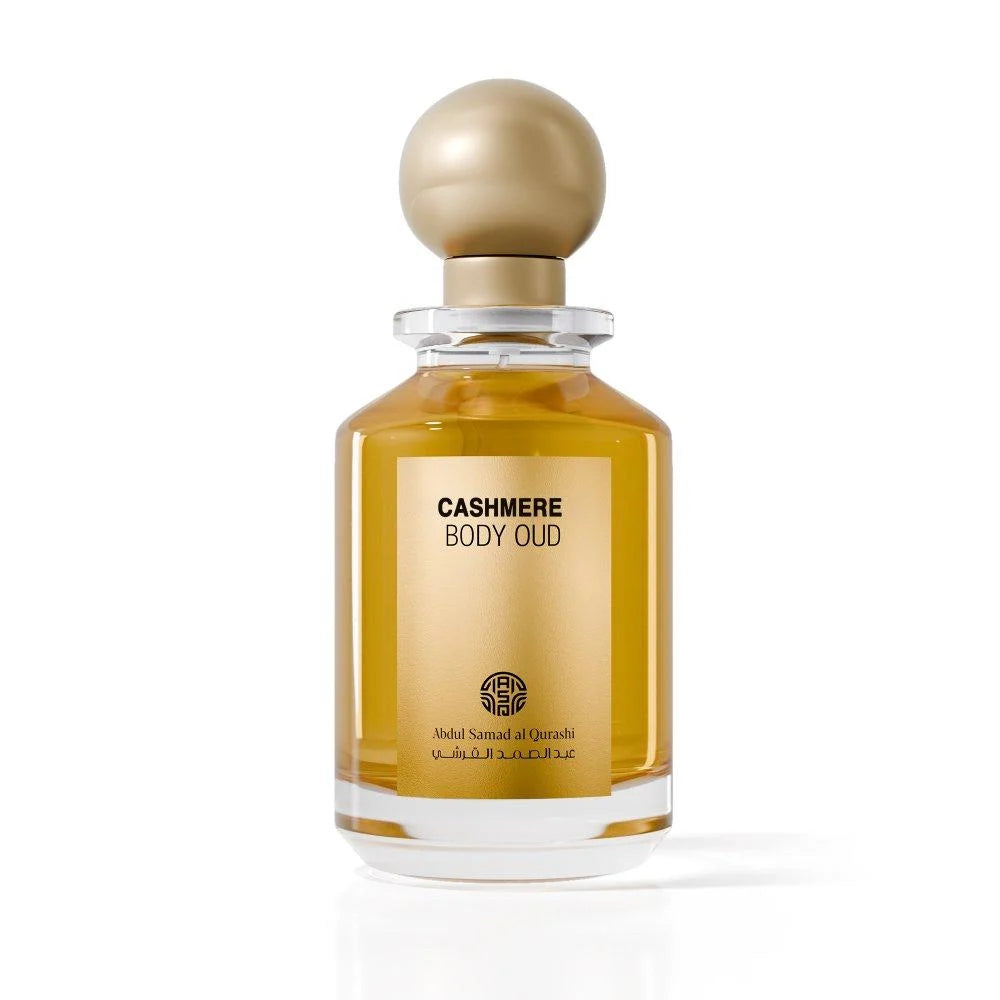 Perfume bottle labeled 'Shadow Wood Body Oud' on a white background
