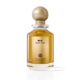 Silk Body Oud perfume bottle with gold cap on a white background