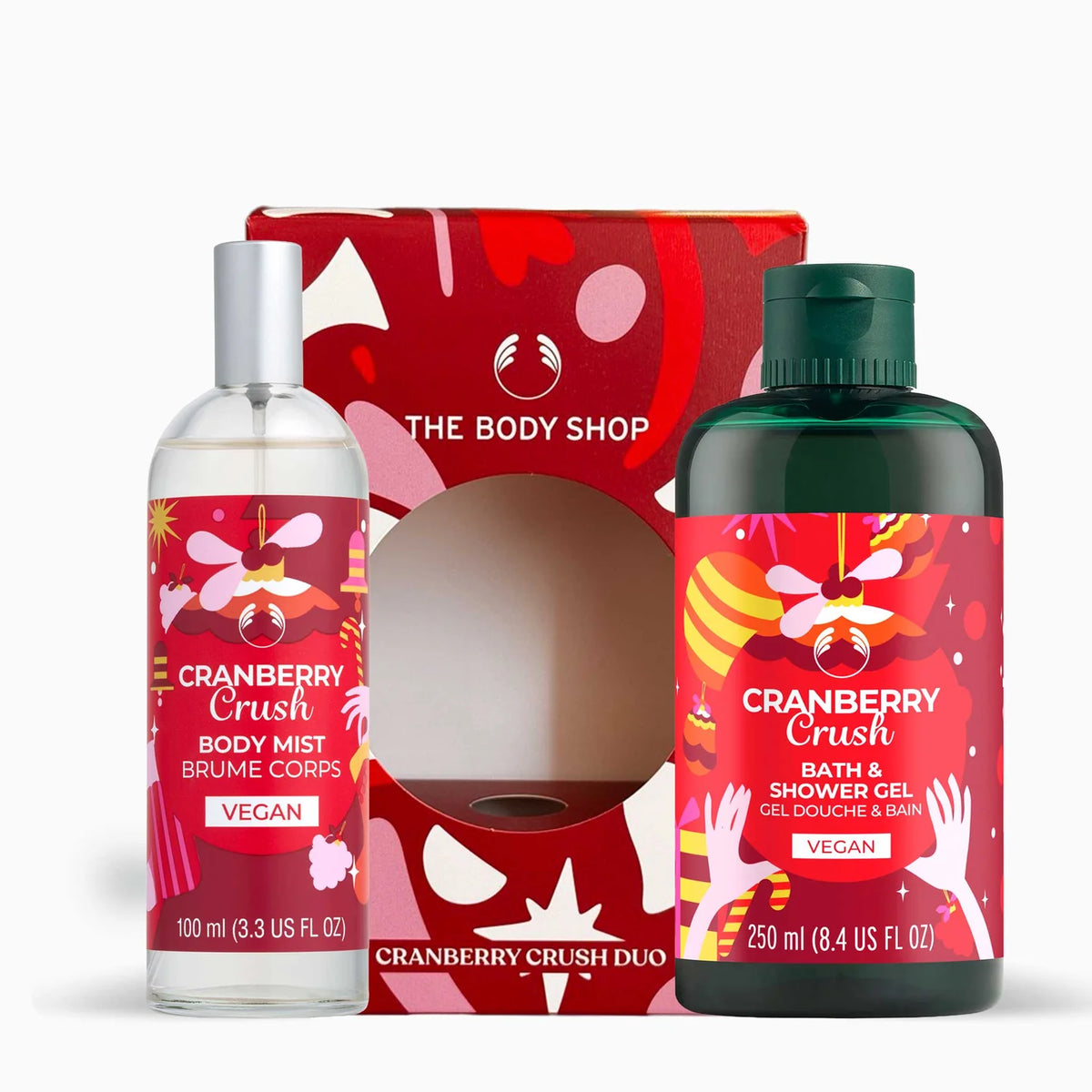 The Body Shop Cranberry Crush Duo gift set featuring a 100ml body mist bottle and a 250ml bath & shower gel bottle, both with red labels and silver/green caps, displayed in front of their red patterned gift box.