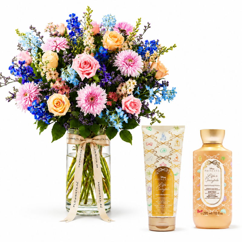 A floral gift set featuring a large, vibrant bouquet of pink, blue, and peach flowers in a glass vase with a ribbon, alongside a tube and bottle of Bath & Body Works 'Love & Fragrance' products on a white background.