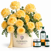 A gift set featuring a large arrangement of yellow roses in a cream-colored round box with a tassel and the 'FLOWRISTA' logo, alongside three skincare products from 'The Body Shop' including Vitamin C body wash, Vitamin C serum, and Vitamin C hand cream, all set against a plain white background.