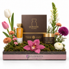"Qurashi Blend Gift Set by Abdul Samad Al Qurashi with mixed artificial flowers in a Flowrista pink tray - luxury fragrance gift Dubai"