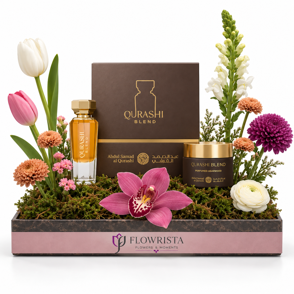 "Qurashi Blend Gift Set by Abdul Samad Al Qurashi with mixed artificial flowers in a Flowrista pink tray - luxury fragrance gift Dubai"