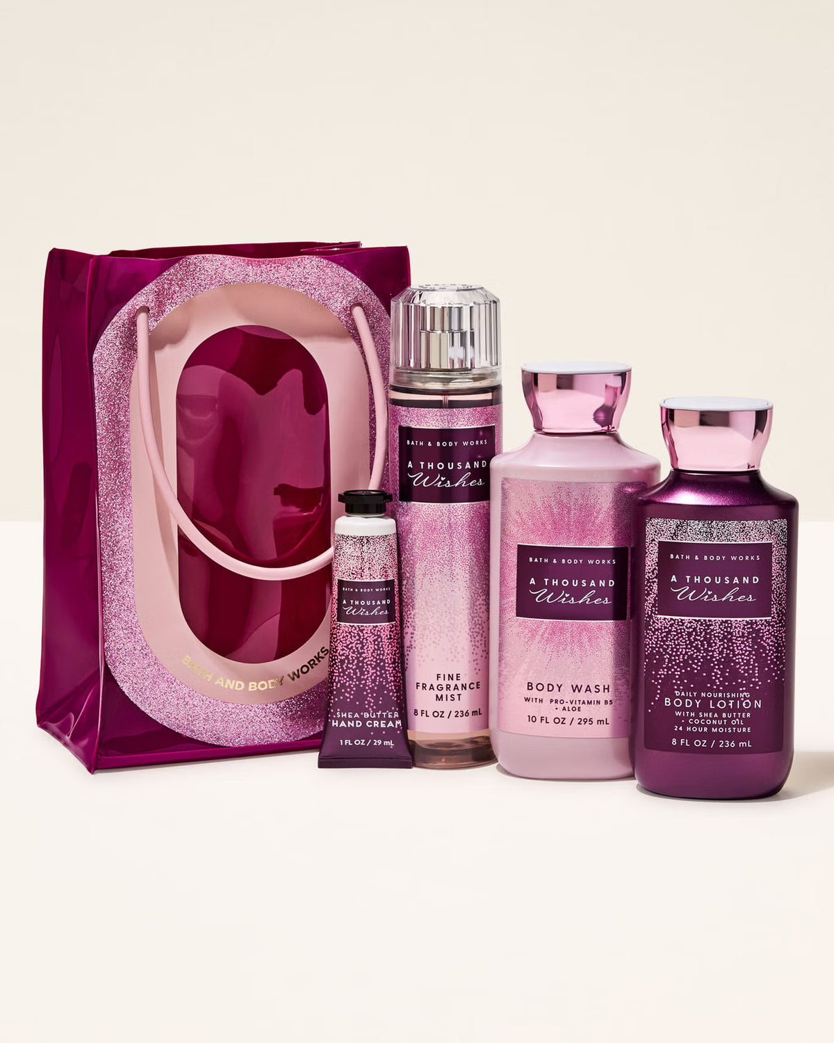 Bath and Body Works product set including a bag, bottles, and containers on a white background