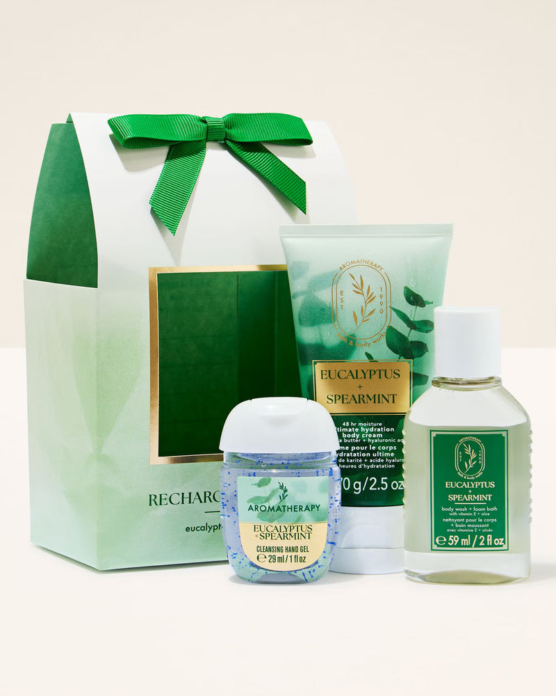 Eucalyptus-themed skincare products including a bottle, tube, and small container with a green and white color scheme.