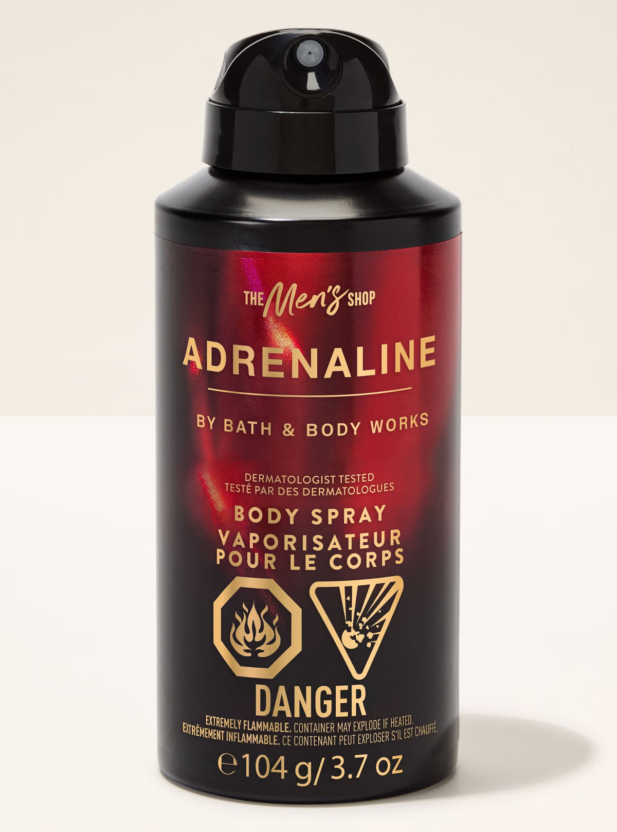 Body spray bottle labeled 'Adrenaline' by Bath & Body Works on a beige background