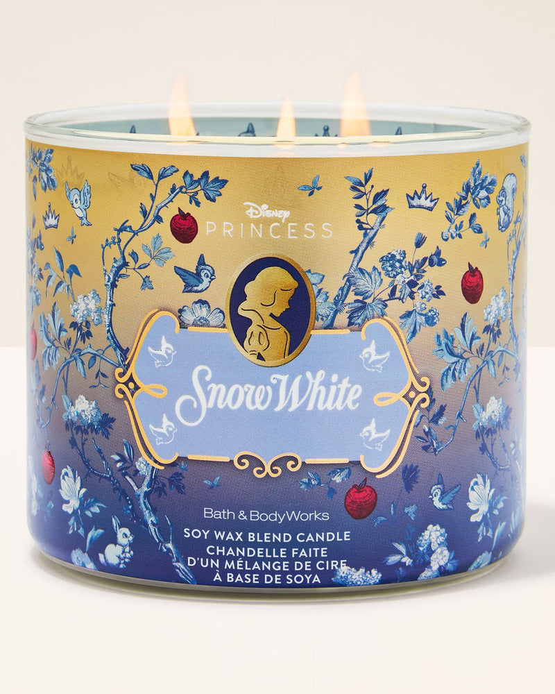 Snow White-themed candle with decorative design on a white background