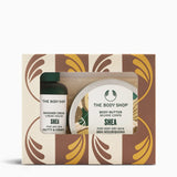 The Body Shop Shea Body Butter and Shower Cream gift set in a patterned box with a clear window showing the products inside.