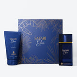 Safari Blue fragrance gift set featuring a blue shower gel tube, a blue perfume bottle with gold detailing, and a matching blue box with gold tropical line art, set against a clean white background.