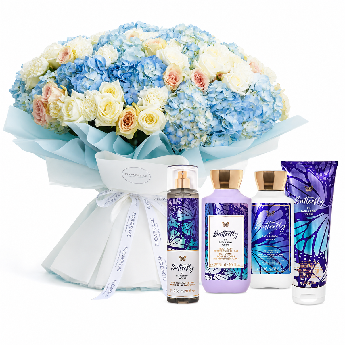 A floral gift set featuring a large bouquet of blue, white, and peach flowers wrapped in light blue paper, alongside four Bath & Body Works Butterfly scented products including a body spray, lotion, hand cream, and a body wash tube.