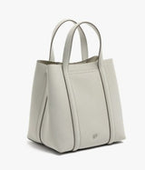 A light gray leather tote bag with dual top handles, shown from a three-quarters angle against a clean white background.