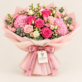 Flowrista pink hydrangea and rose bouquet with eucalyptus in pale pink wrapping