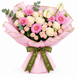 Flowrista pink gerberas cream roses and white anthuriums in pink wrapping with olive green ribbon