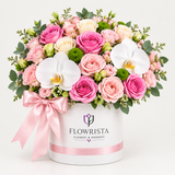 Flowrista pink rose and white orchid flower arrangement in a white vase