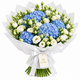 Flowrista blue hydrangea and white lisianthus bouquet in white wrapping with matching bow