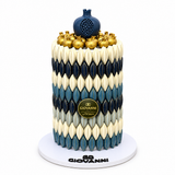 Giovanni Khufu chocolate pyramid in blue, navy and white with gold decorations on a white base