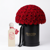 Ocean Whisper perfume beside a dome of 300 red roses in a tall black Flowrista box