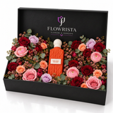 Nude Coral Diamond perfume with fresh mixed roses, pink ranunculus and eucalyptus in a black Flowrista gift box