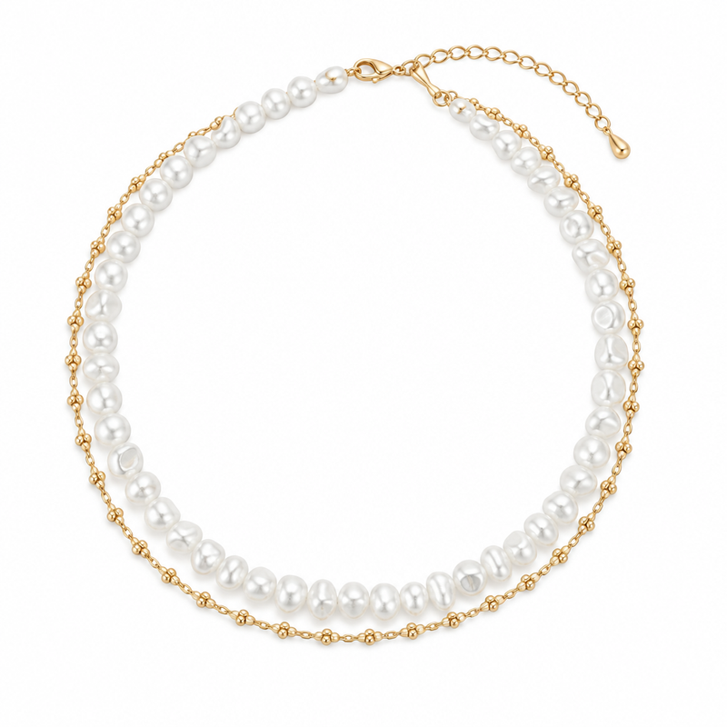 Pearl-style necklace with fine gold-tone chain on a white background