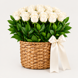 Flowrista white flower basket with lush green leaves and white ribbon