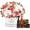 Asser perfume oud bakhoor and air freshener beside Flowrista pink rose and white orchid hatbox