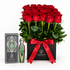 Fakher green silver perfume and box beside fresh red roses in a black Flowrista box with red satin ribbon