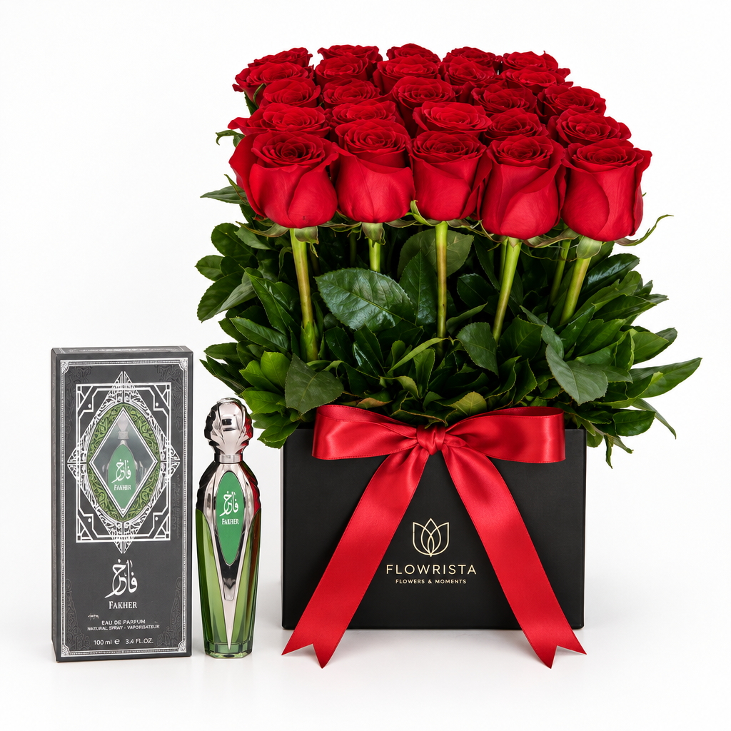 Fakher green silver perfume and box beside fresh red roses in a black Flowrista box with red satin ribbon