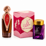 Asser perfume bottle with Bakhoor Saher Alkalmet purple jar and pink presentation box on a white background
