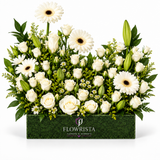 Artificial white roses, gerbera flowers and lily buds with greenery in a rectangular green Flowrista box