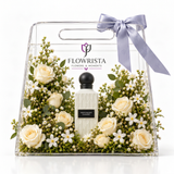White Regent Diamond perfume with white roses in a clear Flowrista acrylic gift bag with lavender bow