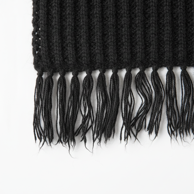 Close-up detail of Mango black fringed edge scarf knitted texture