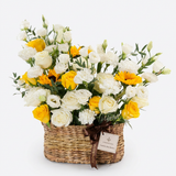 Sunshine Bliss Basket with fresh white and yellow roses, white lisianthus and sunflowers with Flowrista ribbon
