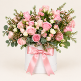 Flowrista soft pink rose arrangement in a white vase