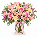 Flowrista glass vase with pink and cream roses, white filler flowers and pale pink ribbon