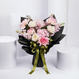 Flowrista pink bouquet with hydrangeas and roses on white background