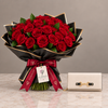 ALDO Olira cream wallet beside Flowrista red roses in black and gold wrapping