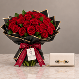 ALDO Olira cream wallet beside Flowrista red roses in black and gold wrapping