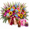 Asser perfume and Saher mamoul beside Flowrista grand sunflower and mixed flower basket
