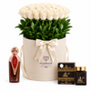 Asser perfume and Bakhoor Ashek Al Oud beside white roses in an ivory Flowrista flower box
