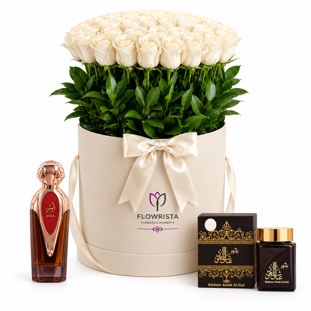 Asser perfume and Bakhoor Ashek Al Oud beside white roses in an ivory Flowrista flower box
