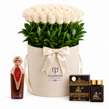 Asser perfume and Bakhoor Ashek Al Oud beside white roses in an ivory Flowrista flower box