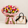 ALDO Mondiane cream and black satchel beside a colourful Flowrista tulip bouquet