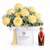 Asser perfume beside cream roses and baby's breath in a white Flowrista flower box